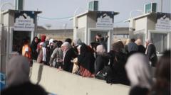 Palestinian women waiting at a border checkpoint in the West Bank