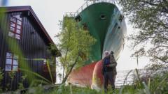 Man in Norway wakes to find huge container ship in garden