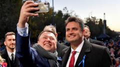 Opposition candidate for prime minister Peter Marki-Zay poses for a picture with a supporter in Budapest, Hungary, on 23 October 2021