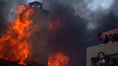 Wildfires continue to rage in Greece as extreme heat persists
