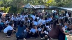 Schoolchildren run from collapsing roof as ground shakes in Philippines quake
