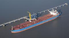An oil tanker docked at a terminal