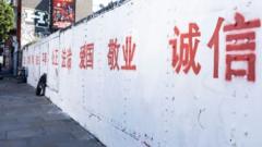 Photo of the red Chinese characters on Brick Lane's wall