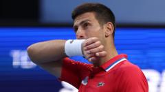 Djokovic beaten by De Minaur as Australia progress
