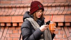 Woman scrolls through phone