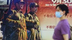 A movie-goer walks by a poster for the blockbuster The Battle at Lake Changjin at a cinema in Hangzhou