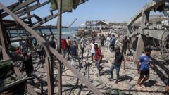 At least 20 Palestinians killed in Israeli strike on Gaza seafront cafe, witnesses and rescuers say