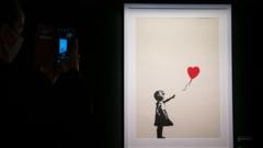 Two men charged over stolen Banksy artwork