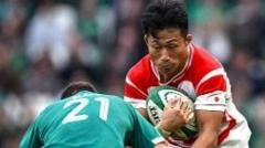 Tomoki Osada of Japan in action against Caolin Blade of Ireland