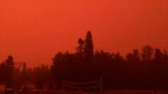 Watch: Canadian wildfires torch vehicle, turn sky deep red