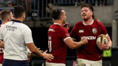 Ireland lock Joe McCarthy (right) celebrates scoring a try