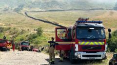 UK heatwave to intensify in second week as wildfires burn across UK