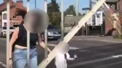 Woman and child in near miss at level crossing