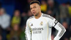 Mbappe set for tests on knee but no surgery planned