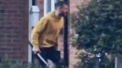 Watch: Man seen carrying sword outside houses