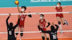 Members of the Chinse women's volleyball team wear N-95 masks during play against Iran