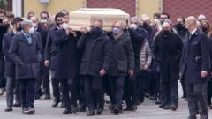 The coffin of Paolo Rossi leaves the Santa Maria Annunciata Cathedral in Vicenza, northeastern Italy