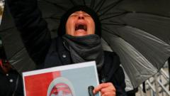 Woman at pro-Iranian protest rally in Istanbul (13/12/22)