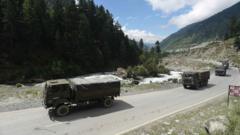 Indian army vehicles move along a highway leading to Ladakh, at Gagangeer some 81 kilometers from Srinagar, the summer capital of Indian Kashmir, 01 September 2020.