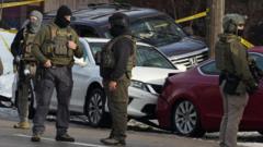 Ciidamada ICE ee howlgallada ka wada Minnesota oo haweeney toogtay