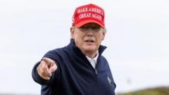 Former U.S. President Donald Trump gestures during a round of golf at his Turnberry course on May 2, 2023 in Turnberry, Scotland.