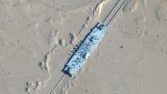 A satellite image shows a mock-up US military ship in the desert in Xinjiang, north-western China