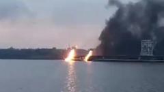 Ukraine's largest dam ablaze after Russian strikes