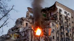 At least 13 killed in large-scale Russian missile and drone strikes on Kyiv
