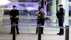 Armed police at Canberra airport. Photo: 14 August 2022