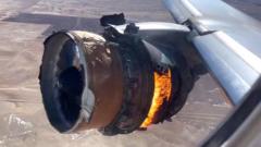 The plane's engine in flames filmed from the passenger window