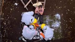 Rescuers tend to the man in the well in Bali
