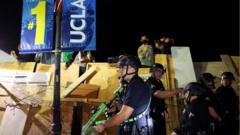 Police rip down barricades as they move in on Gaza protest in LA