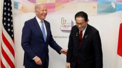 US President Joe Biden (L) is greeted by Japan's Prime Minister Fumio Kishida before their bilateral meeting in Hiroshima on May 18, 2023, ahead of the G7 Leaders' Summit.