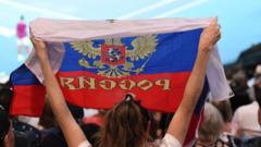 A spectator holds a Russian flag at the Australian Open