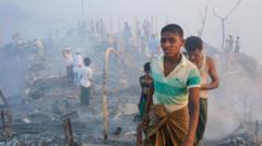 Rohingya refugees search for their belongings after a fire broke out in Balukhali refugee camp in Ukhia, Cox's bazar, Bangladesh, 05 March 2023