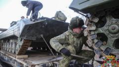 A handout photo made available by the Belarus Defence Ministry press service shows Russian servicemen prepare their military vehicles to unload for Russia and Belarus joint military drill "Union resolve 2022" in Belarus, 18 January 2022