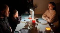 Dinner in the dark as drones explode - life in a Ukrainian city under sustained attack