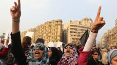 Women shout slogans against the Egyptian security forces in Cairo in December 2013