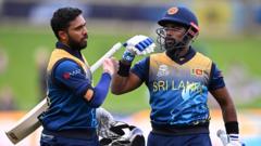 Charith Asalanka and Kusal Mendis of Sri Lanka leave the field after their victory during the ICC Men's T20 World Cup match between Sri Lanka and Ireland at Bellerive Oval on October 23,