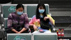 Relatives of passengers on China Eastern flight MU5375 are seen at the holding area, after the plane failed to arrive at Guangzhou Baiyun International Airport in China's southern Guangdong province on March 22, 2022.