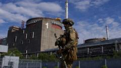 A Russian serviceman patrols the territory of the Zaporizhzhia Nuclear Power Station in Energodar on May 1, 2022.