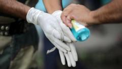 People using hand sanitiser in Kolkata, India in July