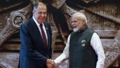 Lavrov and Modi handshake
