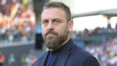 Roma manager De Rossi to stay beyond this season