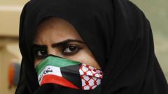 Kuwaiti woman wearing mask with national flag (file photo)
