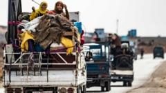 Families flee the border area near the town of Darbasiyah