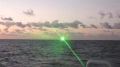 Chinese boat shines green laser on Philippine vessel
