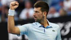 Djokovic overcomes Fritz and heat to reach semis