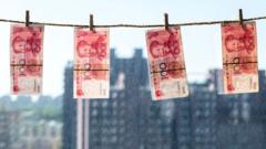 2015/08/21: RMB banknotes hanging in front of window,