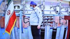 A handout picture made available by the Iranian presidency shows a technician working inside the Natanz uranium enrichment plant during a video conference with President Hassan Rouhani on the occasion of Iran Nuclear Technology Day (10 April 2021)